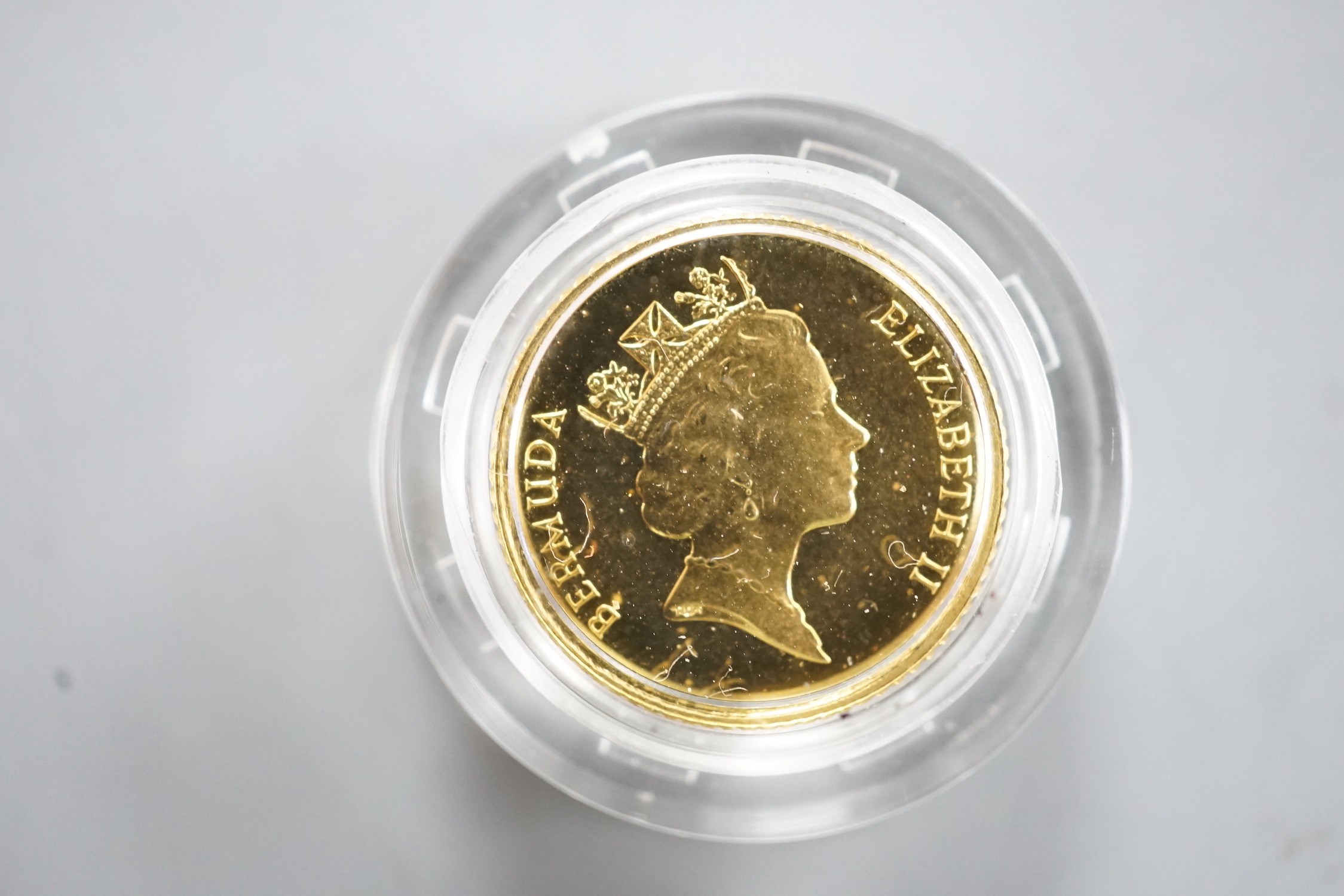 A cased Elizabeth II 1992 ten dollar gold coin.